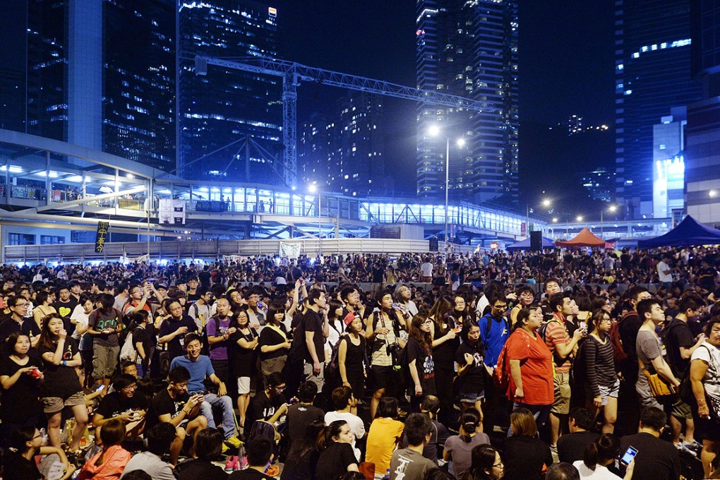 Thousands of pro-democracy protesters gather near the government headquarters in Hong Kong on Saturday. Photo: AP