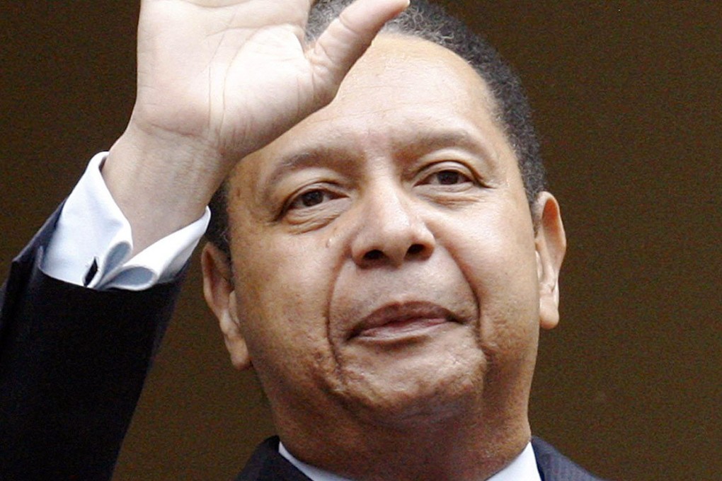 Jean-Claude Duvalier waves on his return from exile in 2011. Photo: Reuters