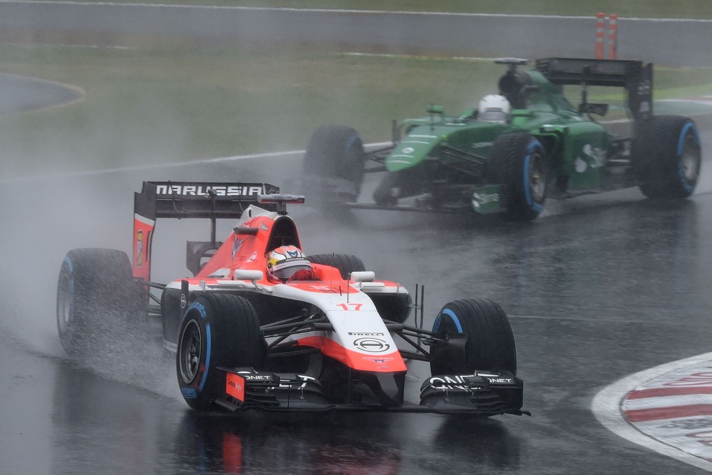 Marussia driver Jules Bianchi (front) of France leads Caterham driver Kamui Kobayashi of Japan before his crash at the Japanese Grand Prix in Suzuka. Photo: AFP