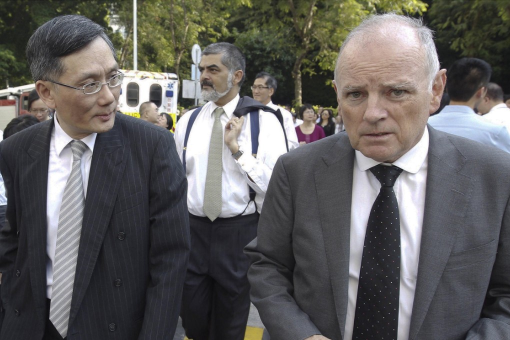 Mr Justice Andrew Cheung Kui-nung (left) and Mr Justice Andrew Macrae wait for the all-clear outside court. Photo: SCMP Pictures
