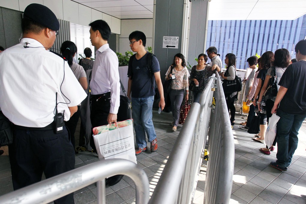 Staff at the government headquarters enjoy a calm arrival at work yesterday. Photo: May Tse