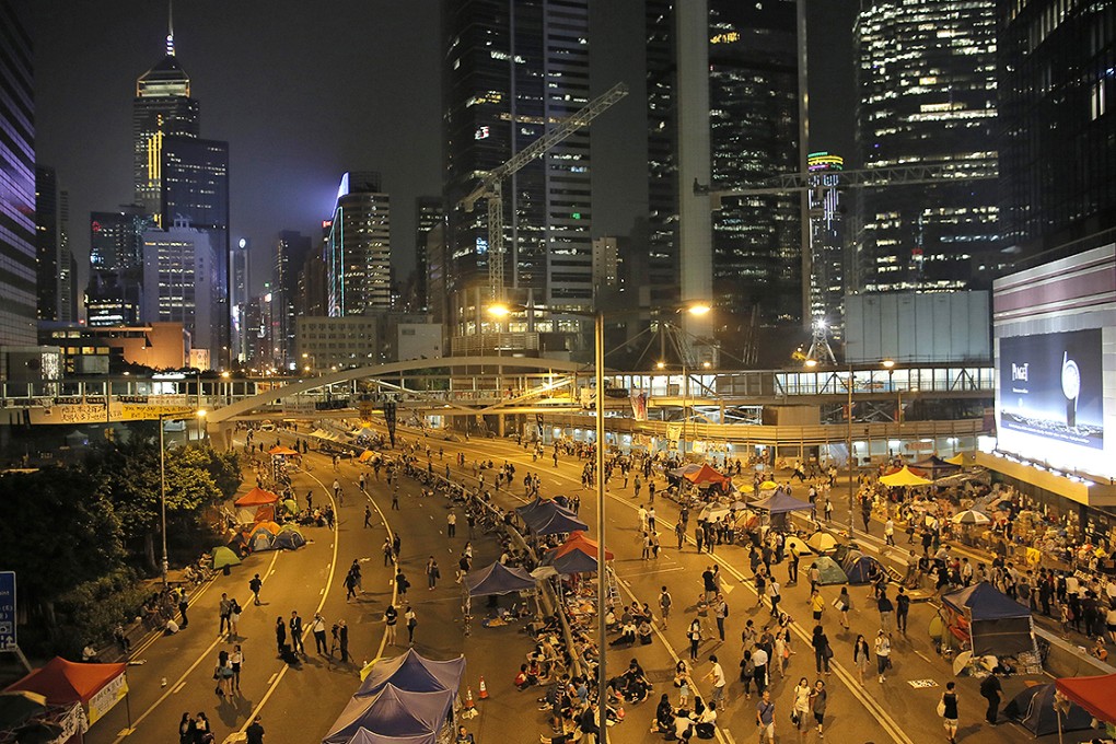 Occupy demonstrators continue to block the main highway in Admiralty on the tenth night of protests. Photo: AP