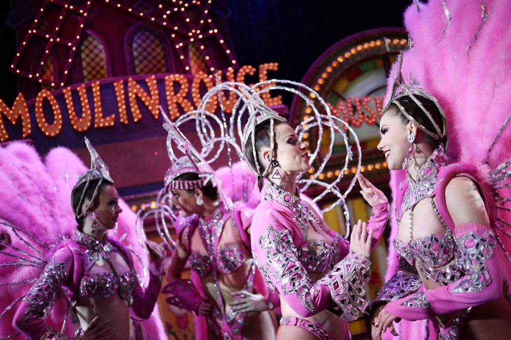 Dancers of the Moulin Rouge discuss after performing at the Moulin Rouge cabaret in Paris. Photo: AFP