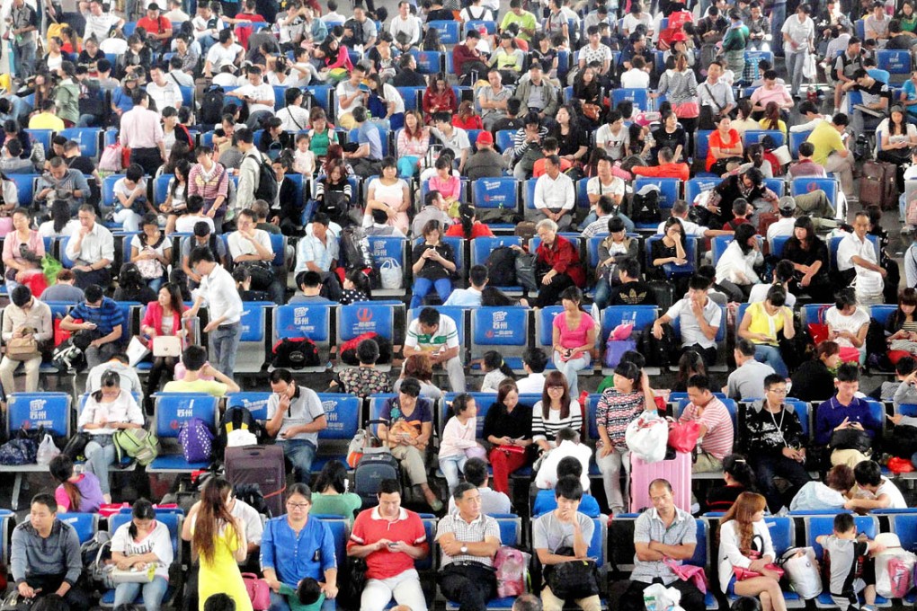 Passengers wait patiently yesterday for their trains at Suzhou Railway Station. Photo: ImagineChina
