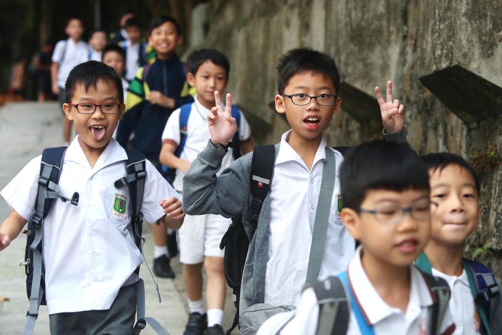 Students of Wan Yan Primary School return to school. Photo: Sam Tsang
