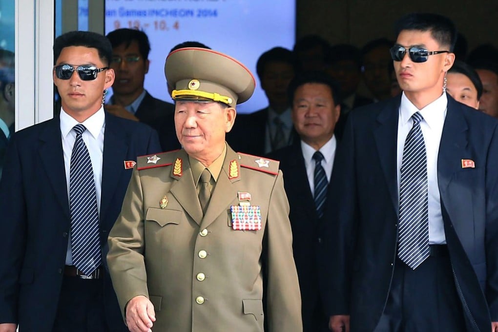 Hwang Pyong-so (centre), flanked by bodyguards, arrives at Incheon International Airport in South Korea for a rare visit. Photo: EPA