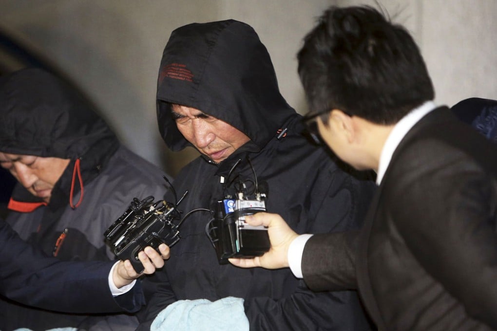 South Korean ferry Sewol captain Lee Joon-seok (centre) outside the court after an investigation in April 2014. Photo: Reuters