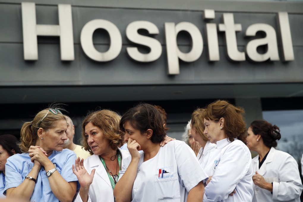 Health workers protest outside La Paz Hospital calling for Health Minister Ana Mato to resign after a Spanish nurse contracted Ebola. Photo: Reuters