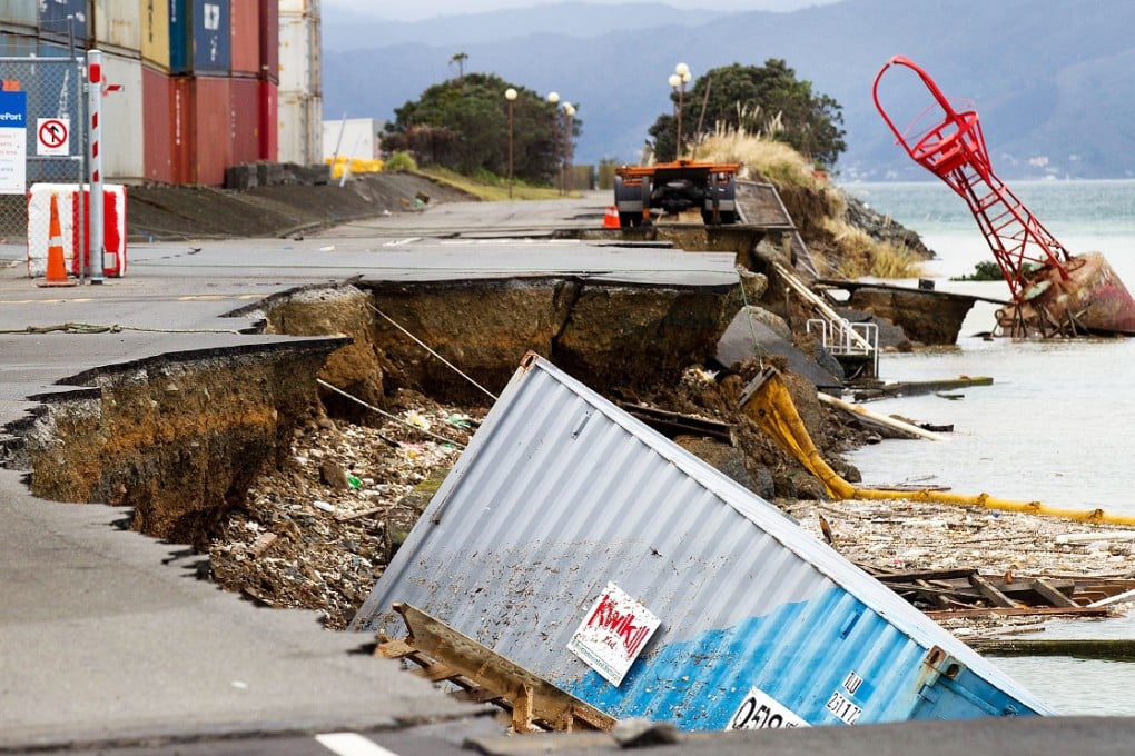 An empty shipping container sits in the harbour where the land fell into the sea at the Port Wellington Container terminal caused by earthquake in July 2013. Photo: AFP