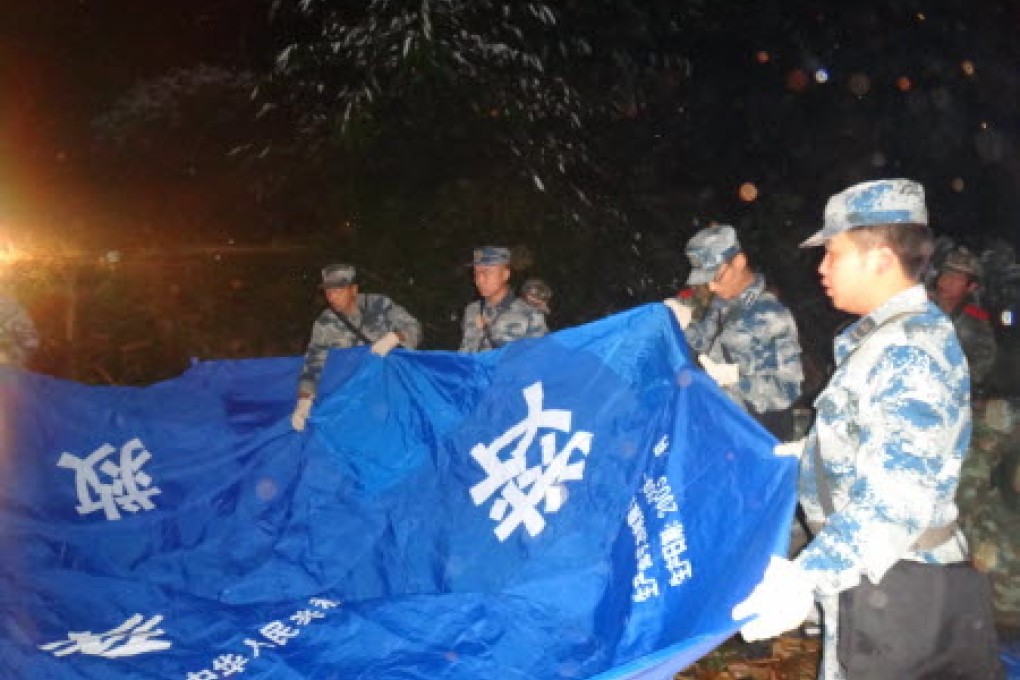 Rescue teams beginning up relief tents in Mengla village, Jinggu county, in Yunnan province after Tuesday night's earthquake. Photo: Xinhua