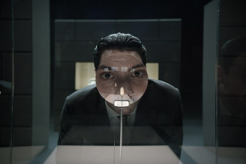 Stephen studies the carved rice grain through a magnifying glass, an opening linking up the last episode.