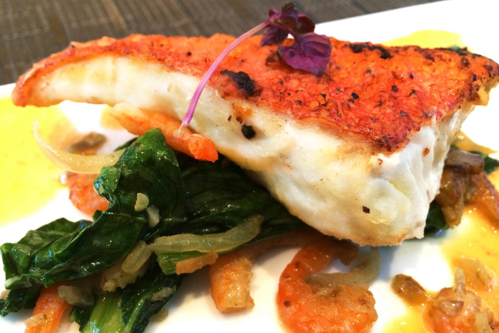 Pan-fried lapu-lapu (grouper) fillet in crab roe sauce is one of many dishes available at the Philippines Food Festival.