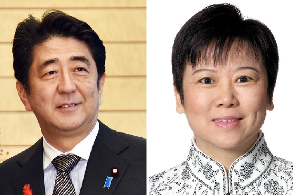 Abe meets Li Xiaolin. Photo: AFP