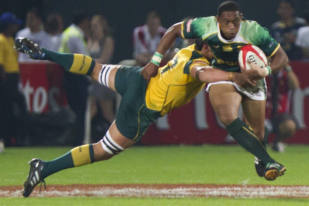Australia's Nick Phipps tackles South Africa's Renfred Dazel in last years Sevens World Series in Dubai. A new season starts this weekend with more to play for - Olympic qualifying. Photo: AP