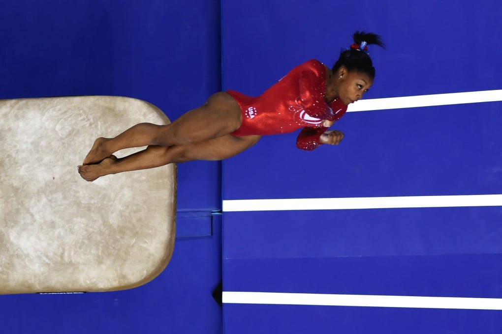 American Simone Biles performs on the vault during the women's team final of the 45th Artistic Gymnastics World Championships in Nanning. Photo: Xinhua