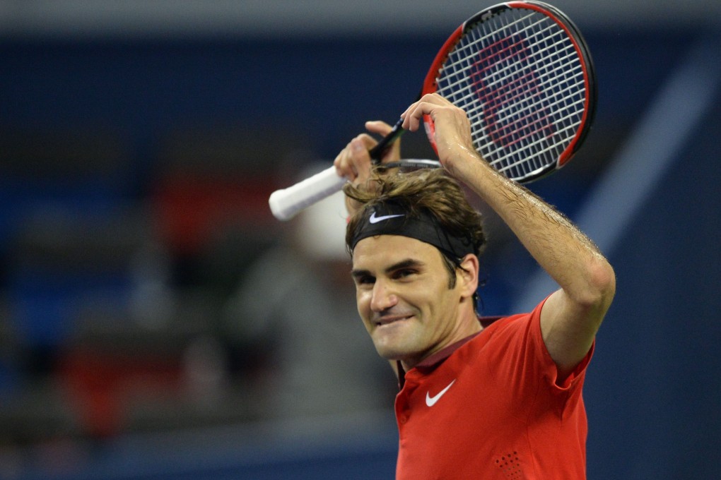 Roger Federer celebrates his win. Photo: AFP
