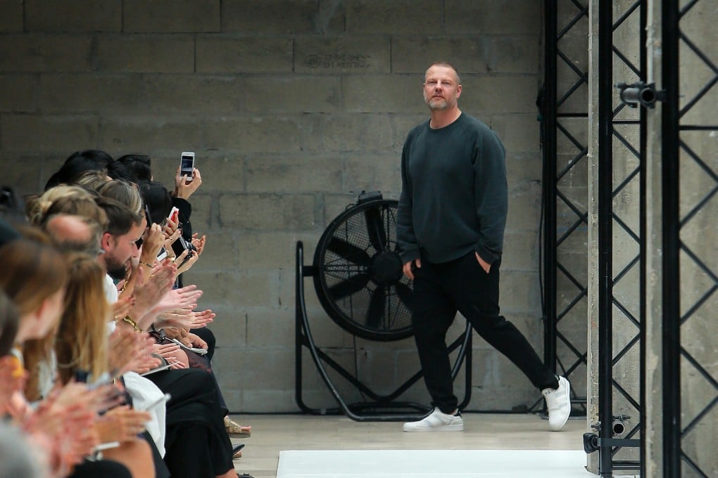 Jonny Johansson takes to the runway after his spring-summer 2015 show in Paris.