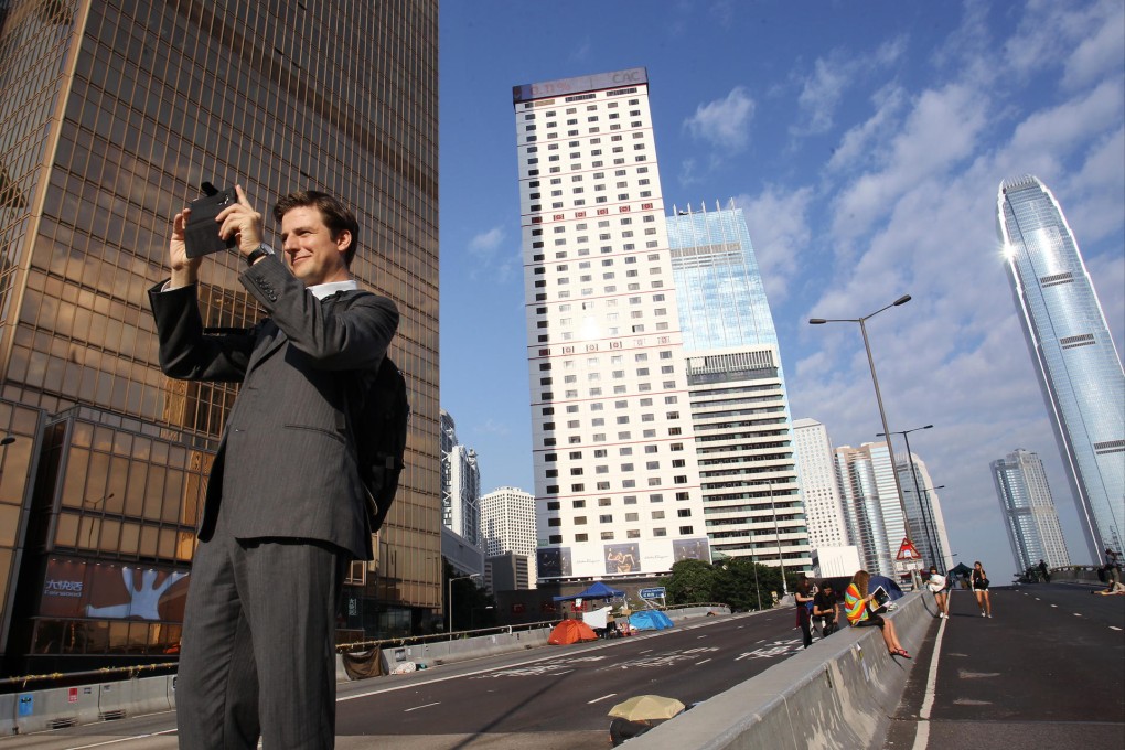 An expat takes pictures at Admiralty protest site. Photo: Dickson Lee