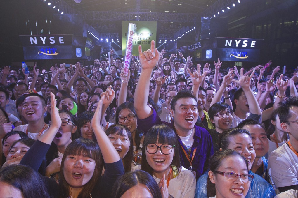 Employees of Alibaba celebrate the successful listing of the company on the New York stock exchange last month. Photo: EPA