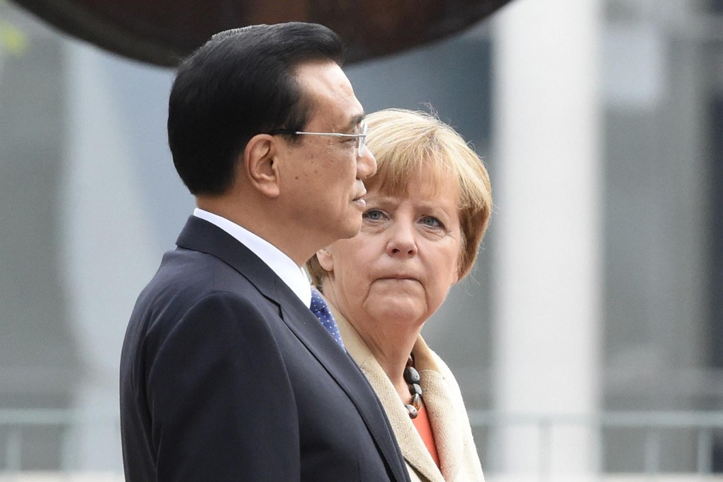 Premier Li Keqiang and German Chancellor Angela Merkel at a welcome ceremony in Berlin. Photo: AFP
