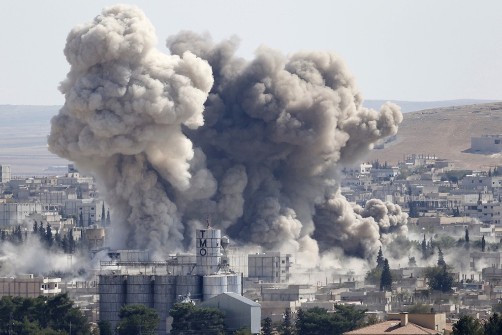 Smoke rises after a US-led air strike in the town of Kobani on the Turkey-Syria border. Photo: Reuters