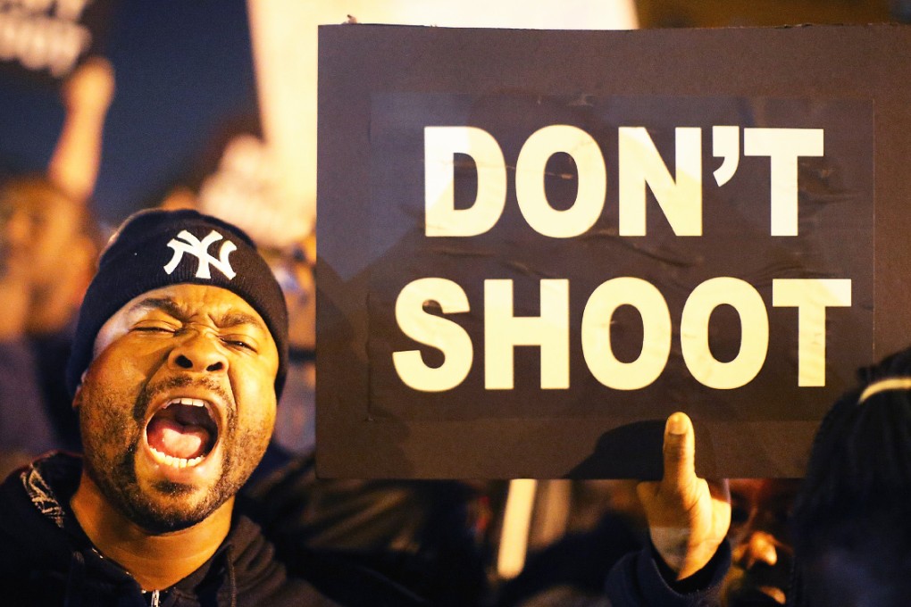 Protesters cheer after blocking an intersection after the vigil in St Louis on Thursday. Photo: AFP