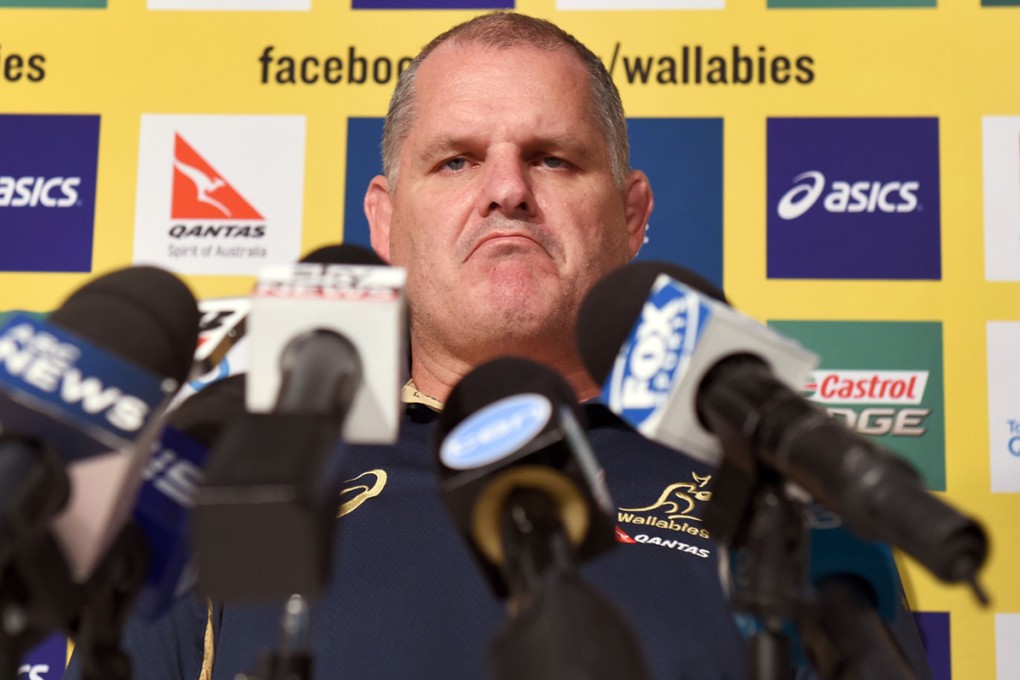 Stony-faced Wallabies coach Ewen McKenzie faces the media Friday and rejects rumours about his relationship with the team's business manager, Di Patston. Photo: AFP