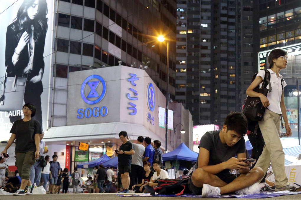 With the streets in Causeway Bay occupied by a few people, the crowds have thinned and the noxious fumes and din of traffic has disappeared. Photo: Bloomberg