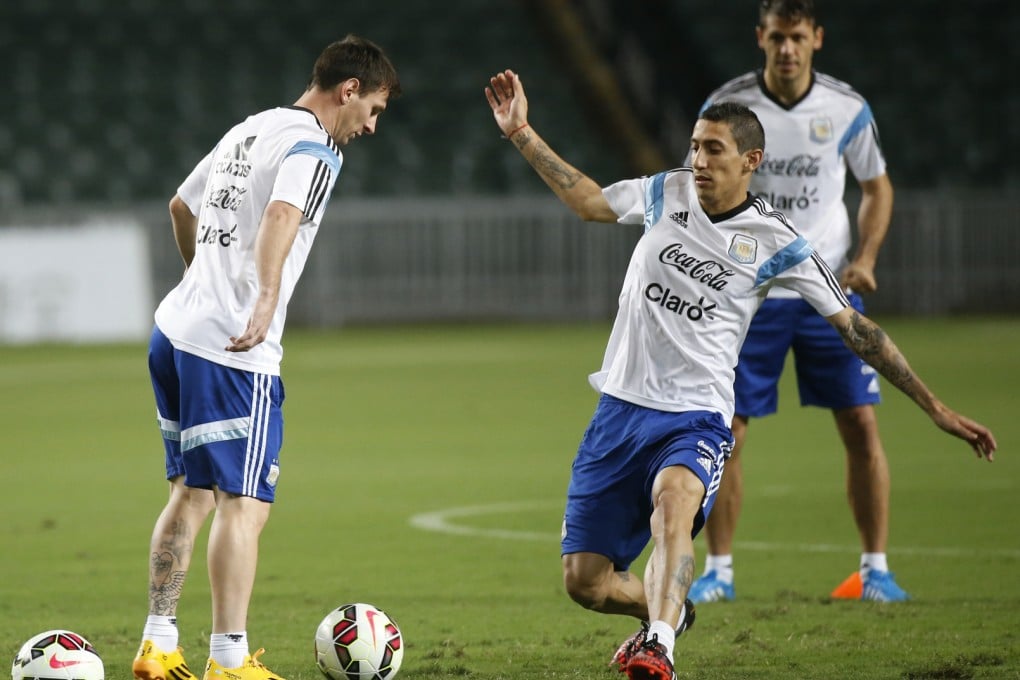 Lionel Messi and Angel Di Maria at a training session in preparation for Tuesday night's friendly against Hong Kong. Photo: AP