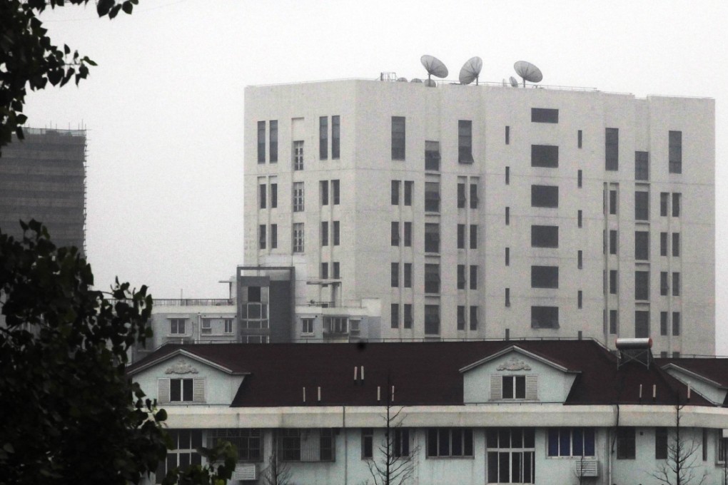 The building housing Unit 61398 of the PLA (top), on the outskirts of Shanghai, is where a US security firm said it had traced cyberattacks on American companies to.  Photo: AP