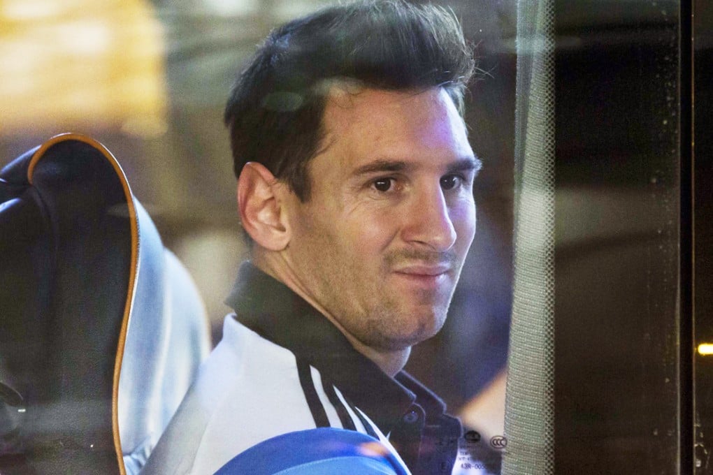 A tired looking Lionel Messi arrives at Hong Kong airport on Sunday night after a friendly game in Beijing the night before. The HKFA is hoping people will turn out to see him in action. Photo: AP