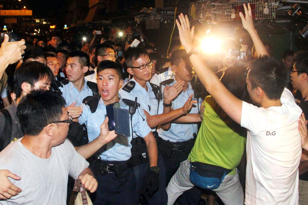 Police officers clash with pro-democracy protesters in Mong Kok. Photo: SCMP Pictures