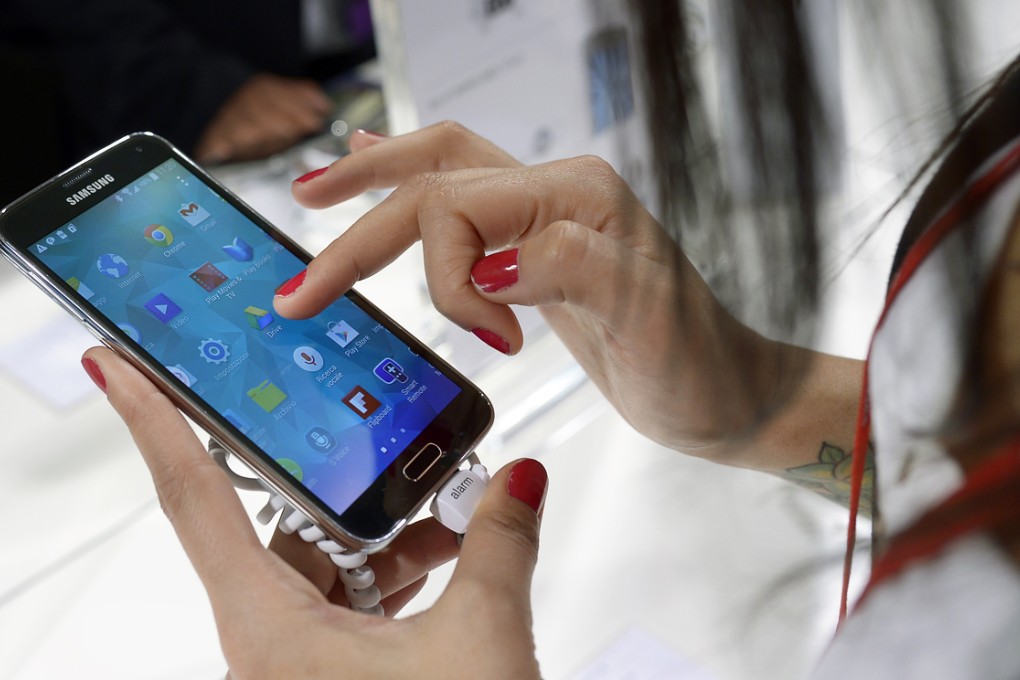 The Samsung Galaxy S5 is demonstrated at the Mobile World Congress in Barcelona, Spain. Photo: AP