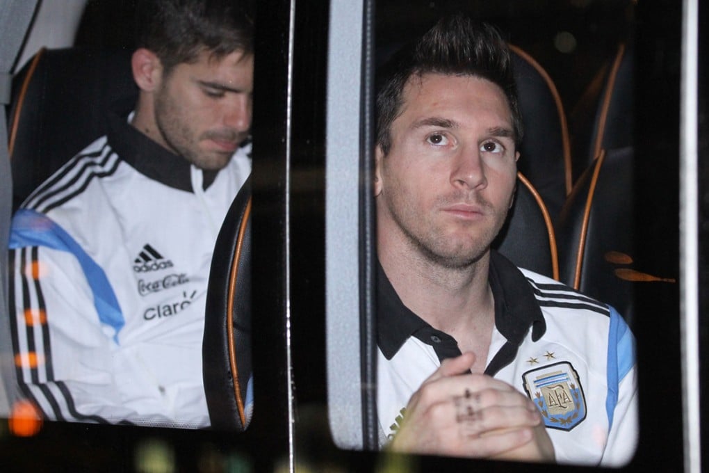 No autographs: José Maria Basanta (left), Lionel Messi and the team were taken straight to their hotel last night. Photo: Edward Wong