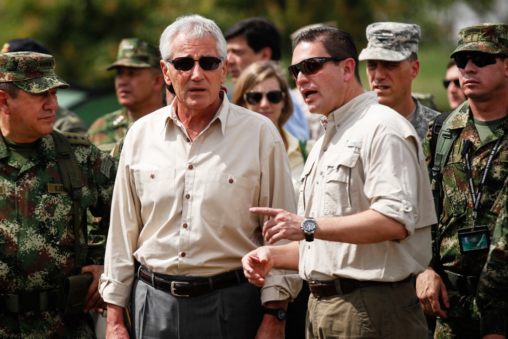U.S. Defense Secretary Chuck Hagel (left), accompanied by Colombia's Defense Minister Juan Carlos Pinzon, visits the Tolemaida batallion in Melgar, Colombia. Photo: Xinhua