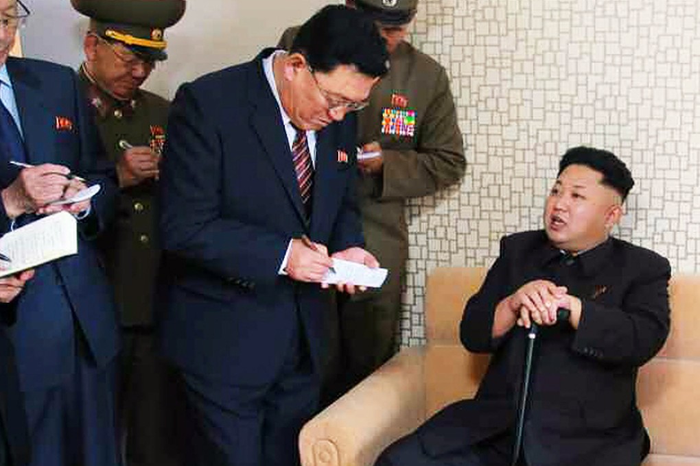 Images released by North Korea's state media show Kim Jong-un relying on a cane. Photo: AFP