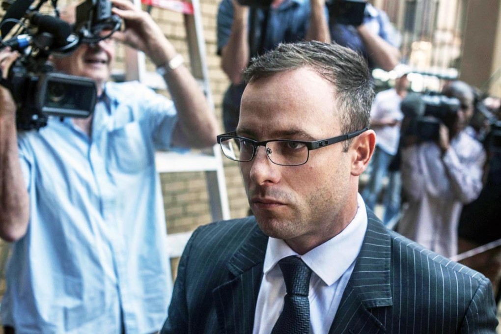 Oscar Pistorius arrives at the High Court for the second day of sentencing in his murder trial in Pretoria. Photo: EPA