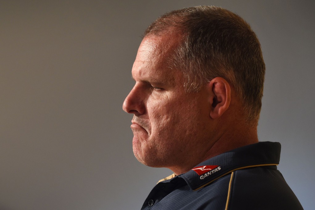 Beleaguered Australia coach Ewen McKenzie faces the media ahead of this weekend's third Bledisloe Cup test against New Zealand. Photos: AFP