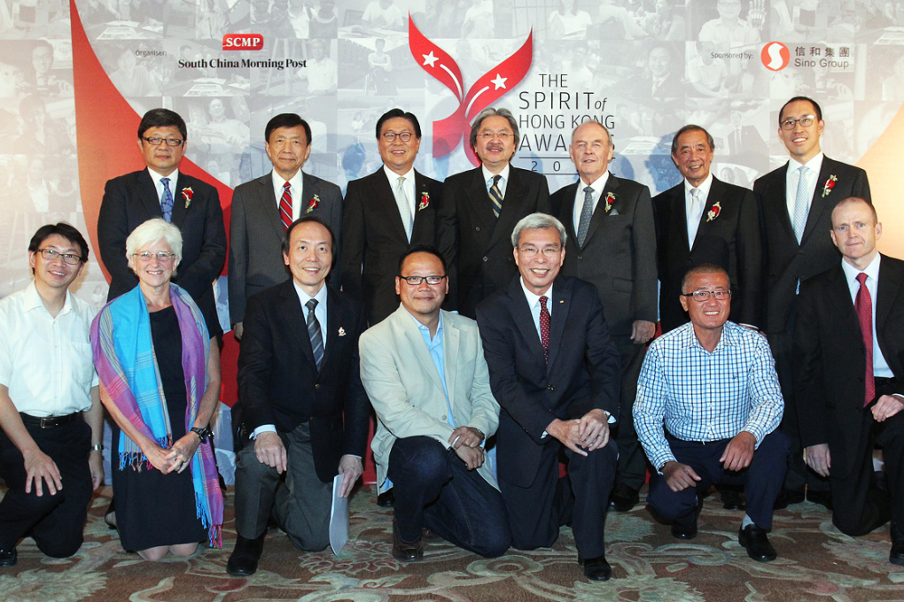 (Front, left to right) Tang Hon-sun (Overcoming Personal Challenge Award, Leung Siu-lun is representative of Leung), Sheila Purves (The People's Choice Award), Poon Tak-lun (The Personal Contribution to Community Award), Michael Tsui Kam-fai (The Innovation for Good Award), Peter Lo Wai-hung from Law Wing Kee Construction & Decoration Ltd (The Corporate Citizen Award), Li Kam-keung (The Self-sacrifice to Achieve Greater Good Award), David Bellis (The Heritage Preservation Award), (Back, L to R) SCMP Group CEO Robin Hu, SCMP Group Chairman David Pang, Professor Frederick Ma Si-hang, Financial Secretary of HKSAR Government John Tsang, James Blake, Ronald Arculli and Sino Group Executive Director Daryl Ng Win-kong, pose for a photograph at the SCMP Spirit of HK Awards 2014 in Conrad Hong Kong, Admiralty. Photo: May Tse