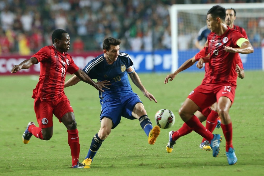 Argentina's Lionel Messi toys with the Hong Kong defence during his team's 7-0 victory at Hong Kong Stadium. Messi scored two goals. Photo: K. Y. Cheng