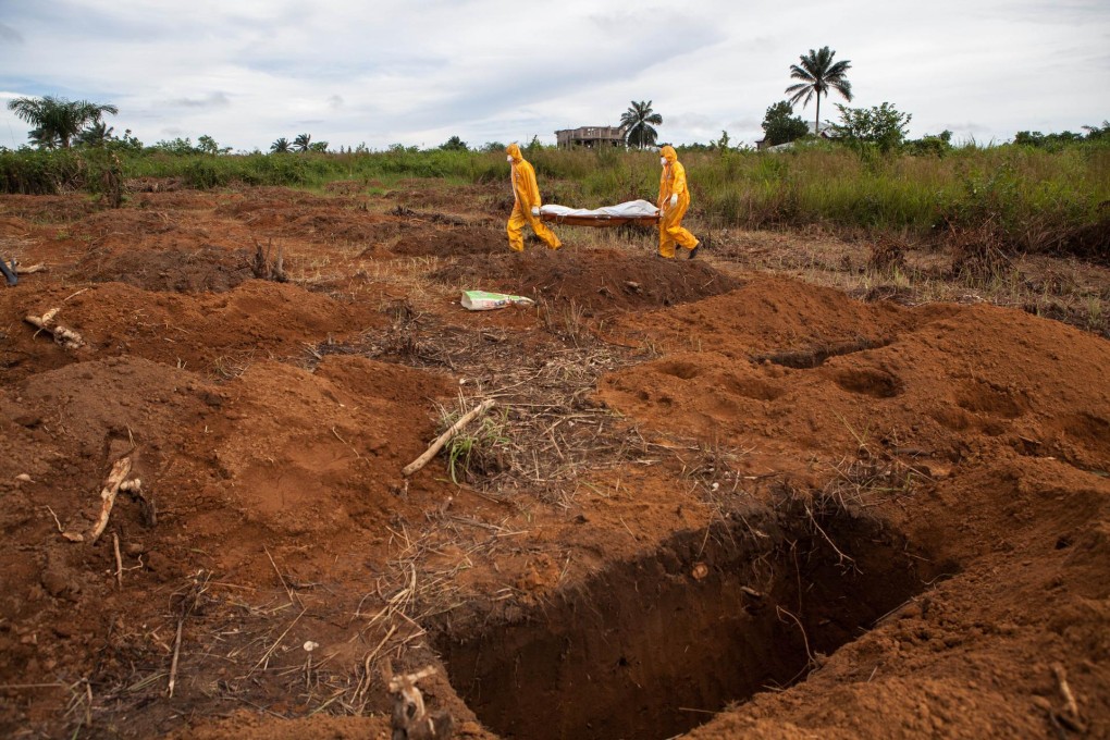 Volunteers on their way to bury the body of a person who died from Ebola in Waterloo, Sierra Leone. Photo: AFP