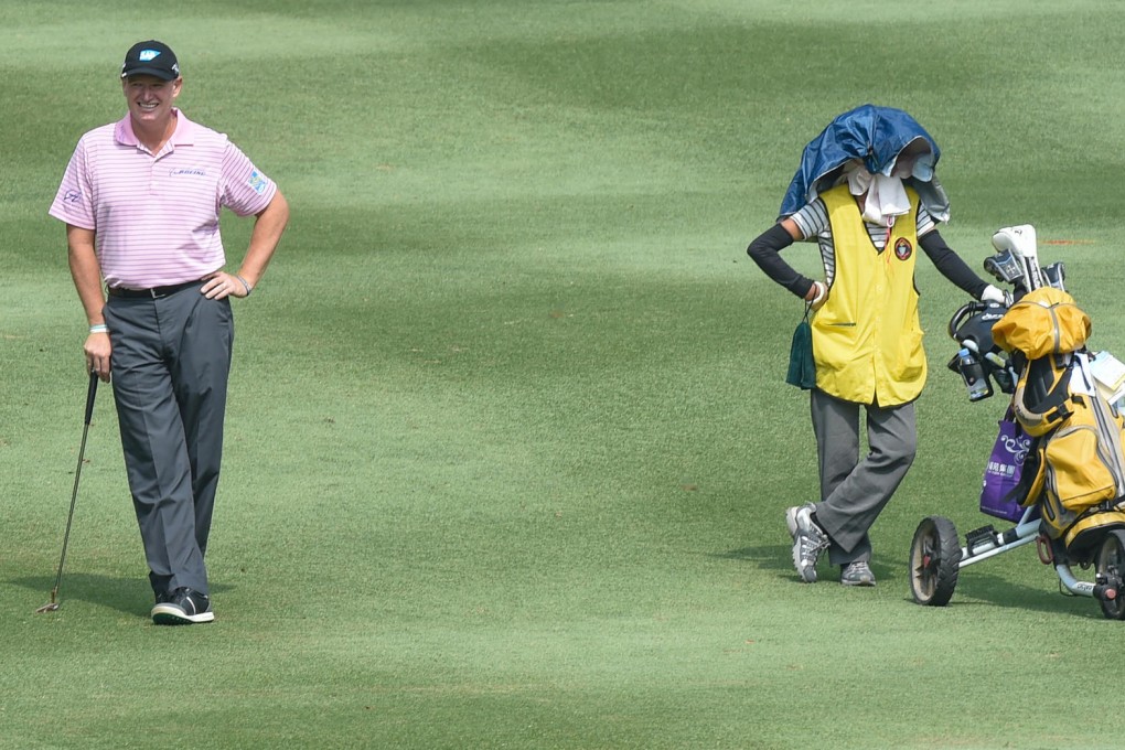 South Africa's Ernie Els is relaxed with his caddie in close quarters ahead of the Hong Kong Open, starting on Thursday. Photos: Richard Castka