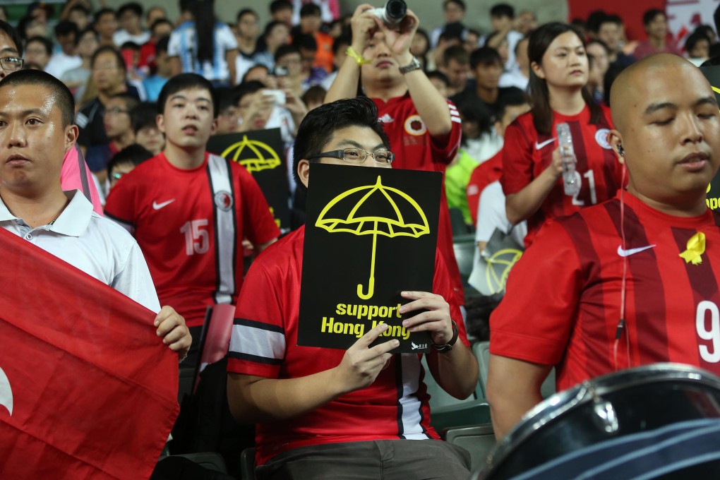Fans who did make it along to Hong Kong Stadium for the HKFA centennial celebration match last night were determined to have a good time, whoever they were supporting. Photos: K.Y. Cheng