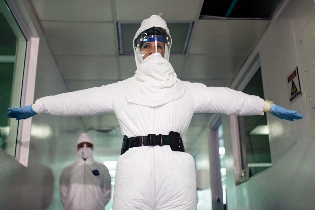 A member of the National Health Institute takes part during a display of the use of a B3 suit of biological protection, in the city of Bogota, capital of Colombia. Photo: Xinhua