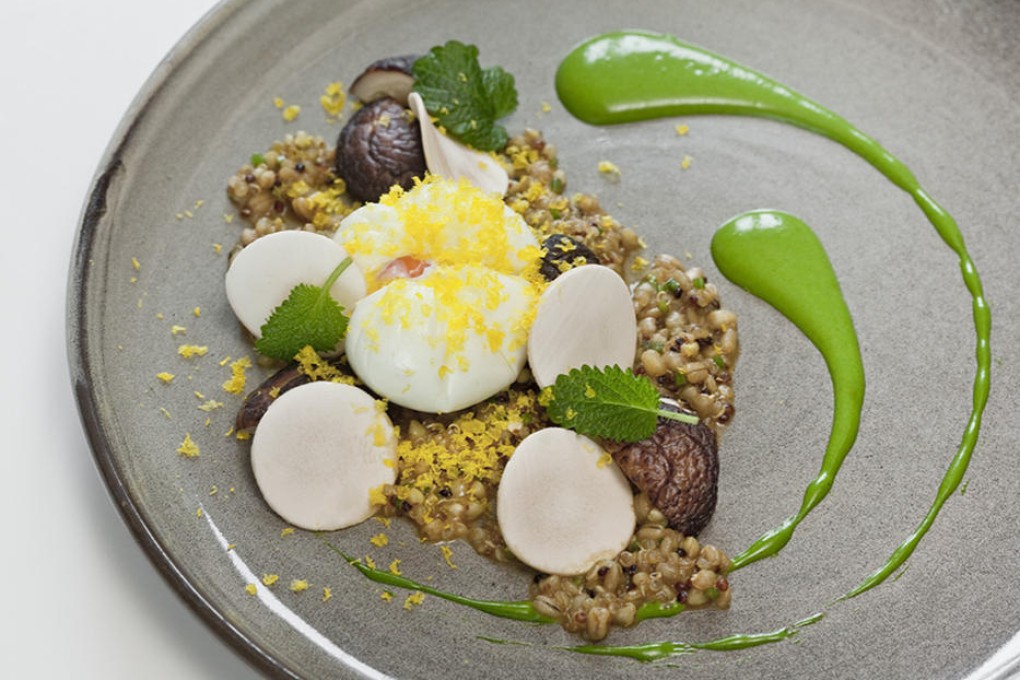 Soft-poached organic egg with mixed quinoa and roasted shiitake mushrooms from Nur.