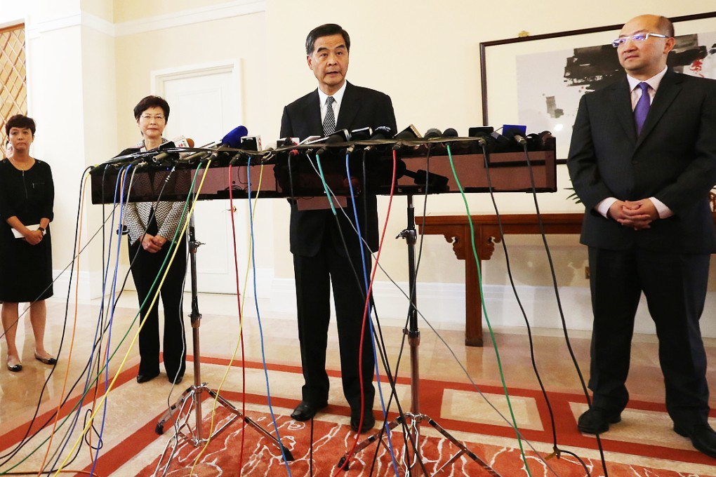 CY Leung arrives for a press conference at Government House on Thursday, followed by Chief Secretary Carrie Lam and Secretary for Constitutional and Mainland Affairs Raymond Tam. Photo: Felix Wong