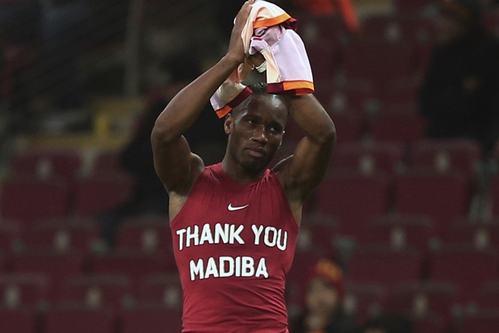 Galatasaray's Didier Drogba from Ivory Coast wears a jersey in sign of respect for Nelson Mandela last year. Photo: AP