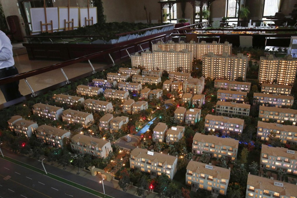 Mainland developers are struggling with loan repayments amid the weakness in the housing market, but property sales are expected to recover next year. Photo: Reuters