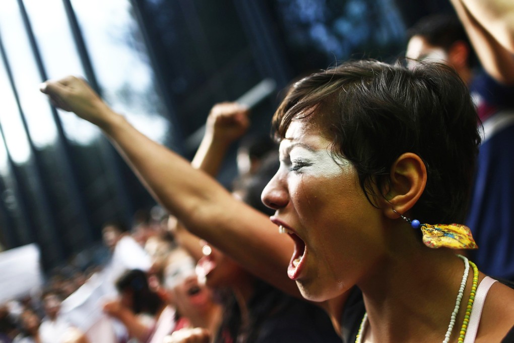 A demonstrator cries during a protest in support of the missing students outside the Attorney General's office in Mexico City. Photo: Reuters