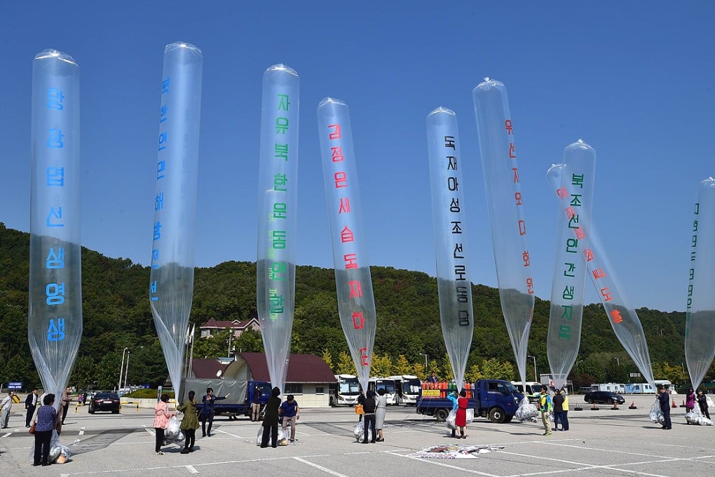South Korean activists prepare to release balloons carrying anti-North Korea leaflets at a park near the inter-Korea border in Paju, north of Seoul last week. Photo: AFP